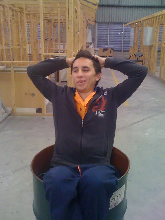 Lewis on a job site in his electrician hi-vis