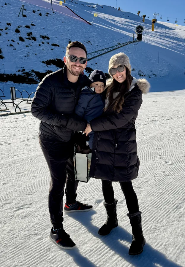 Lewis, Robyn and their son Lex on a snow trip, 2026
