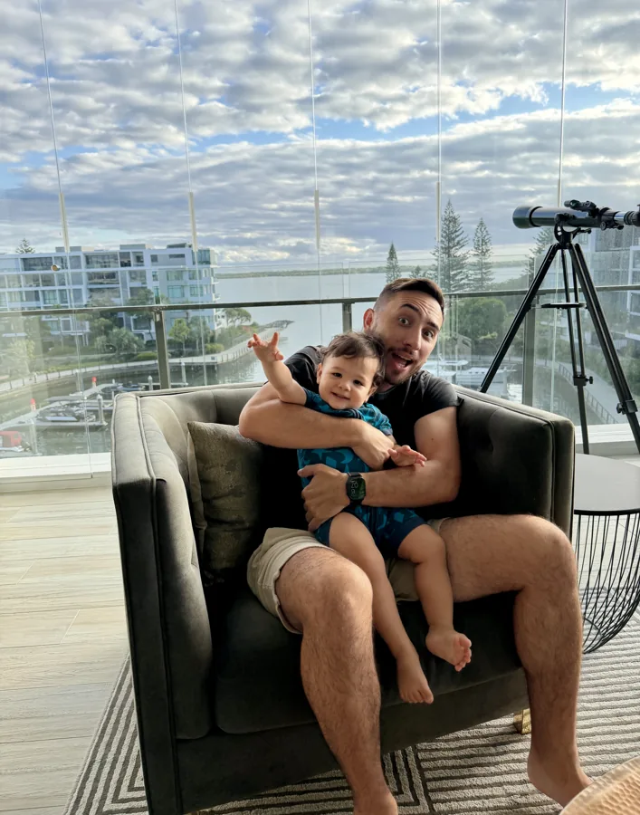 Lewis at home with Lex on his lap